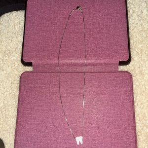 Silver tooth necklace